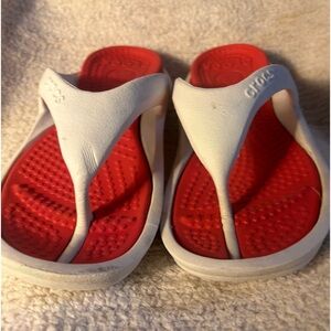 Crocs flip flops. Worm but going strong, get them dirty wash with the hose.